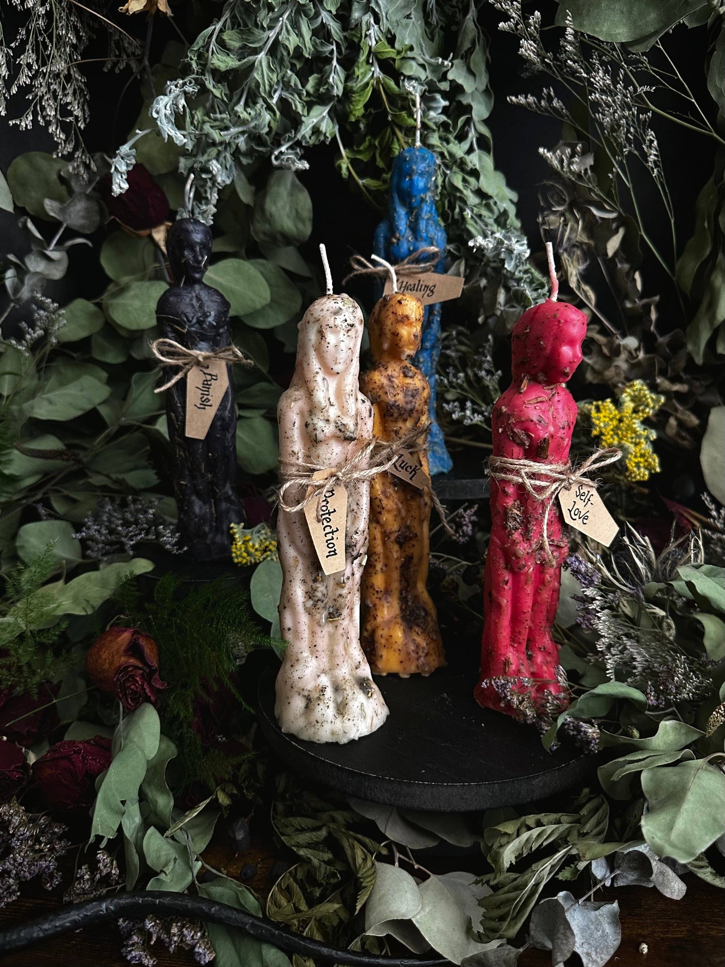 “Dressed human figure intention candle used in ritual and spell work”